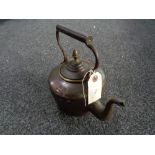 An antique copper kettle