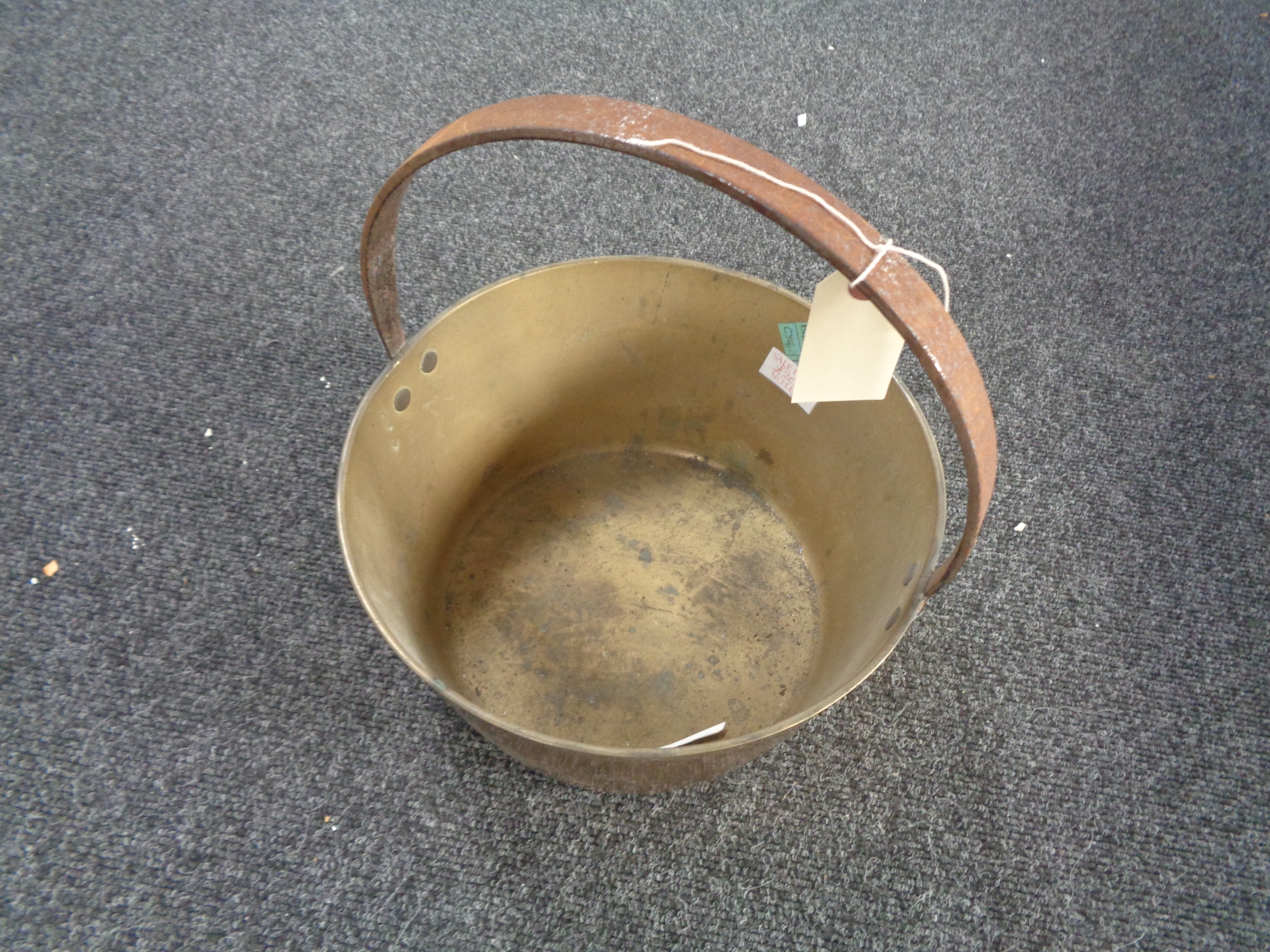 A brass jam pan