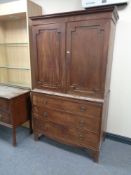 A Regency mahogany double door linen press fitted three internal trays CONDITION REPORT: