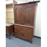 A Regency mahogany double door linen press fitted three internal trays CONDITION REPORT: