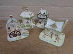 Four Coalport pastille burners to include The Umbrella House, The Crooked Cottage,