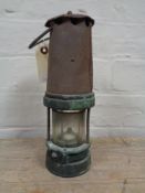 A vintage miner's lamp