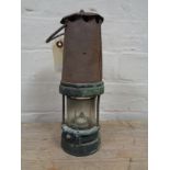 A vintage miner's lamp