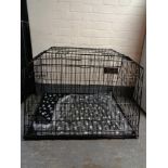 A folding dog cage, with divider,