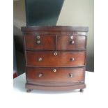 A Victorian four drawer mahogany miniature chest