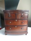 A Victorian four drawer mahogany miniature chest