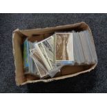 A box of twentieth century black and white & colour postcards