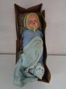 An early 20th century doll in box