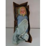 An early 20th century doll in box