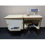 A New Home electric sewing machine in cabinet with accessories