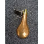 An antique copper and brass black powder flask