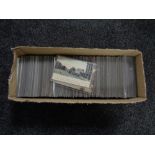 A box of twentieth century black and white & colour postcards