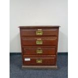An Edwardian pine four drawer chest with brass drop handles