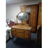 A 1930's oak mirror door wardrobe and dressing chest