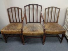 A set six Victorian mahogany rail backed dining chairs with leather upholstered seats
