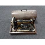 An oak cased vintage sewing machine
