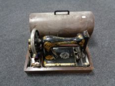 An oak cased vintage sewing machine
