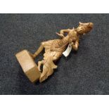 A carved wooden figure - Eastern dancer