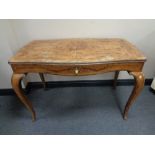 A 19th century French walnut marquetry table on cabriole legs fitted with a drawer and plate glass