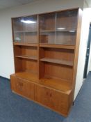 A teak G Plan display unit fitted with four cupboards