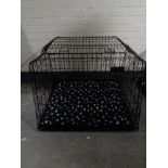 A folding dog cage, with divider,