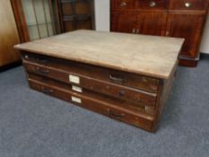 A four drawer plan chest CONDITION REPORT: 126cm wide by 92cm deep by 42cm high.