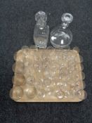 A tray of antique etched glass drinking glasses, cut glass decanter with stopper,