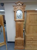 A pine cased Tempus Fugit grand father clock