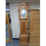 A pine cased Tempus Fugit grand father clock