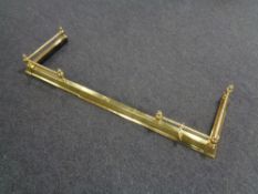 A brass telescopic fire curb