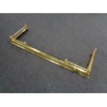 A brass telescopic fire curb