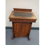 A Victorian inlaid rosewood Davenport