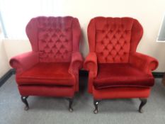 A pair of 20th century wing back armchair in red dralon