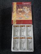 A boxed set of six Rayware gold rimmed wine glasses