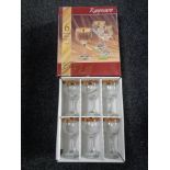 A boxed set of six Rayware gold rimmed wine glasses