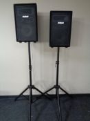 A pair of pro sound PA speakers on tripod stands