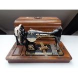 An early twentieth century mahogany cased German sewing machine by Frister and Rossmann