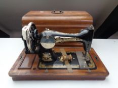 An early twentieth century mahogany cased German sewing machine by Frister and Rossmann