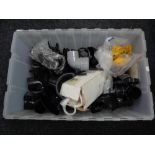 A box of plastic drain pipe fittings