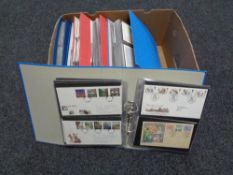 A box of six folders of first day covers