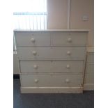 A Victorian painted pine five drawer chest with brass drop handles