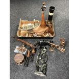 A box containing stone carving, carved wooden African figures,