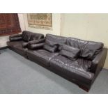 A brown leather three seater settee with matching two seater settee