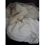 A vintage wedding dress and veil in box