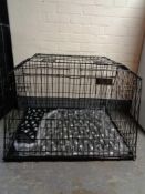 A folding dog cage, with divider,