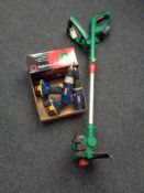 A Qualcast electric strimmer and a box containing boxed CCTV camera and two Ryobi drills