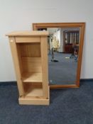 A pine overmantel mirror and set of pine shelves