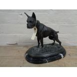 A bronze figure of a Boxer dog on black marble base