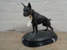 A bronze figure of a Boxer dog on black marble base