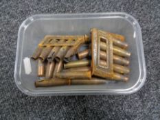 A box of ammunition shell cases and clips